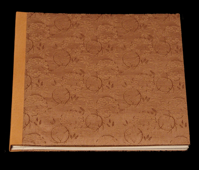 by Karen Hanmer.
Sewn boards binding.
Pigment inkjet prints.
Silk brocade cover with goatskin spine.
Edition 4 of 25.
2006.